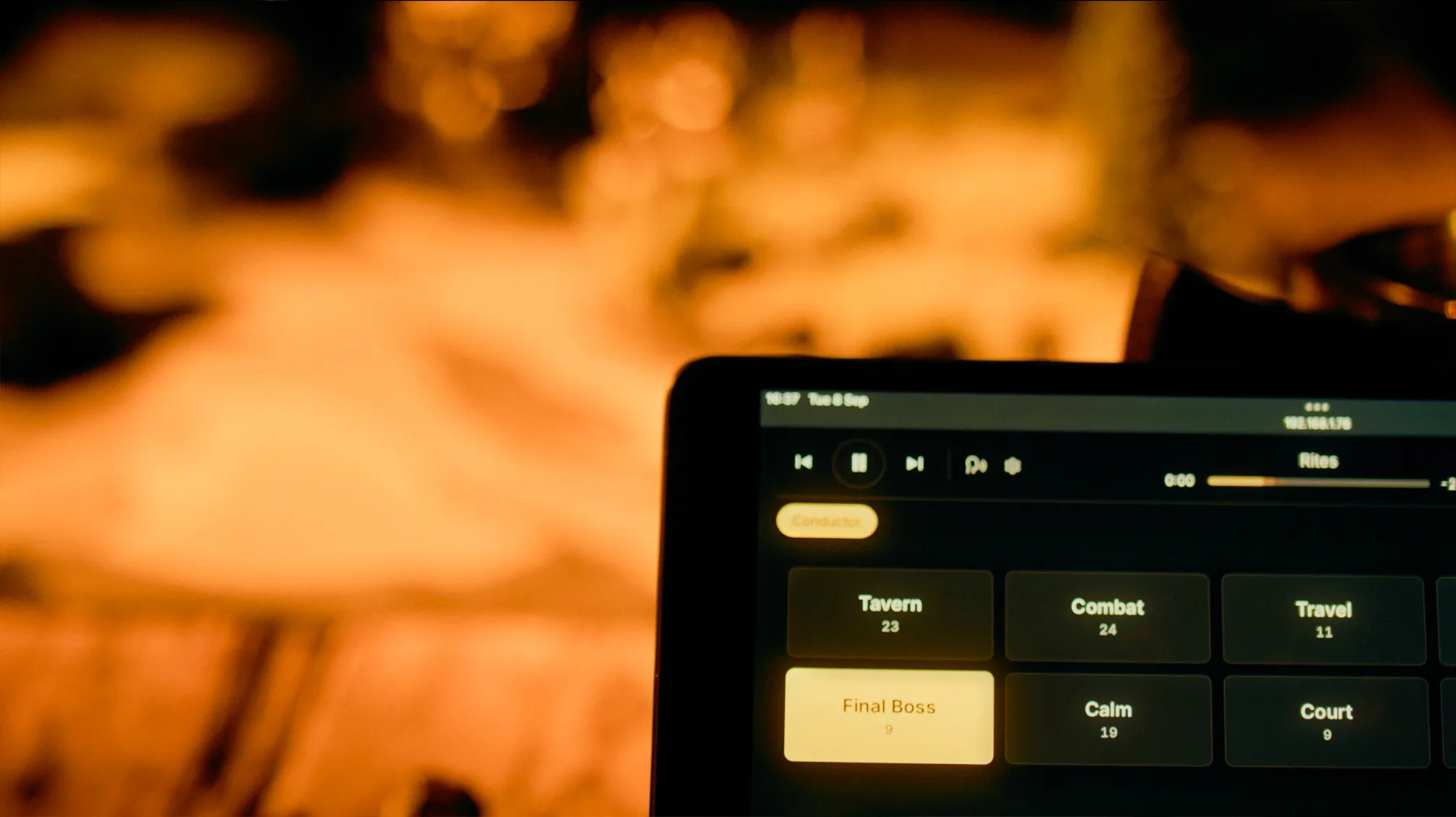 A still from the Bardio trailer: a phone running Bardio at a candlelit table